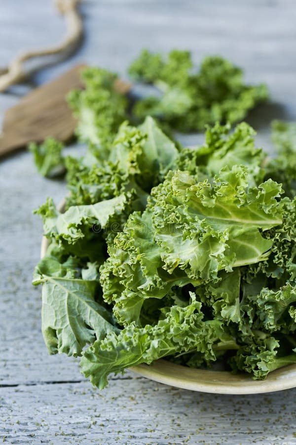 Chopped Kale Leaves for Salad Making, Cooking on Rustic Background ...