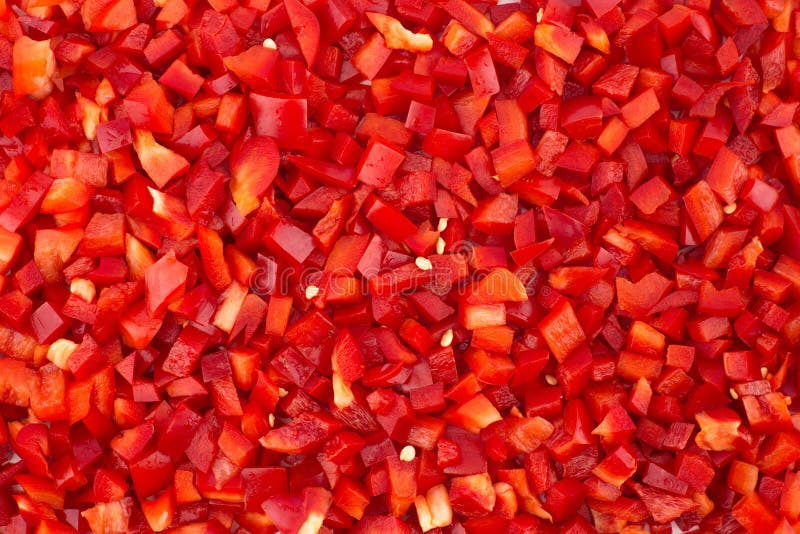 Chopped red peppers texture background.