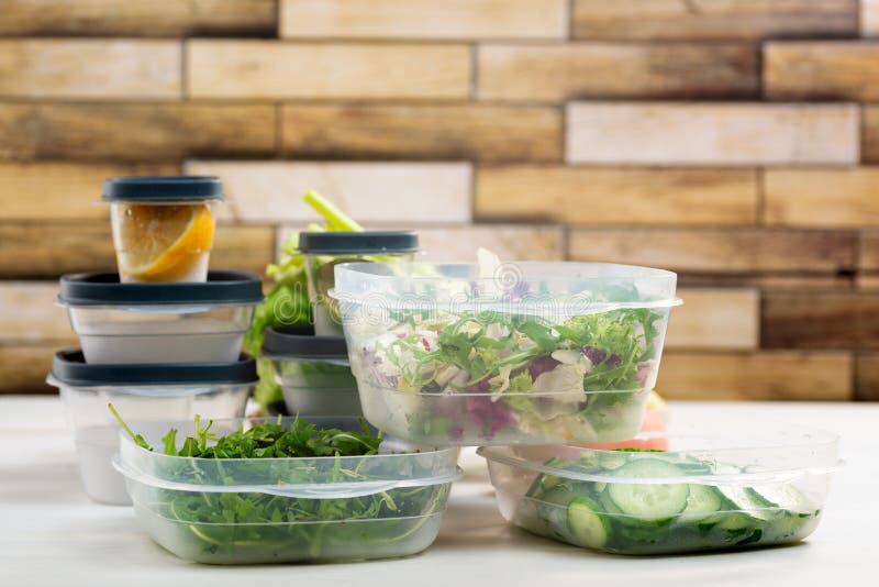 Chopped Salad, Vegetables and Herbs in a Plastic Container. Storing