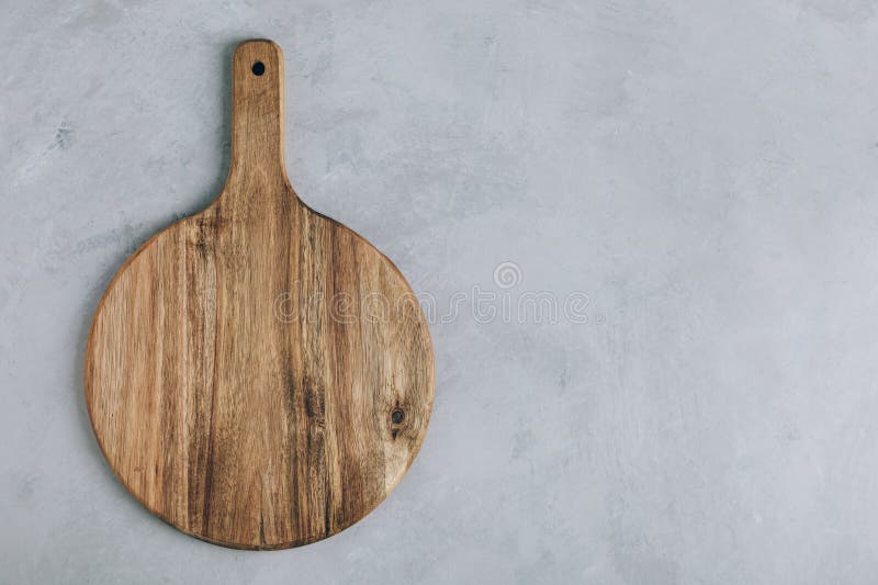 Chopping Board. Empty Round Wooden Cutting Board on Gray Stone