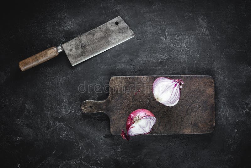 Chopping Board and Halved Red Onion with Meat Cleaver Stock Image