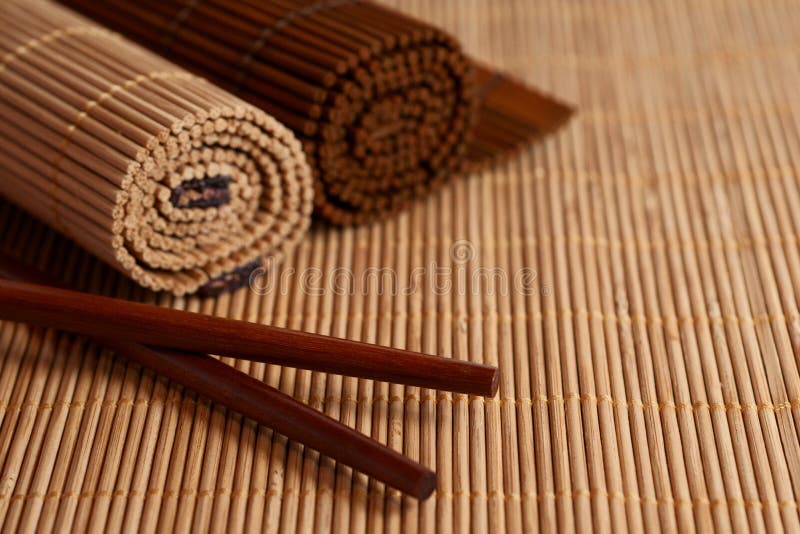 Asian Chopsticks and Bamboo mat on table