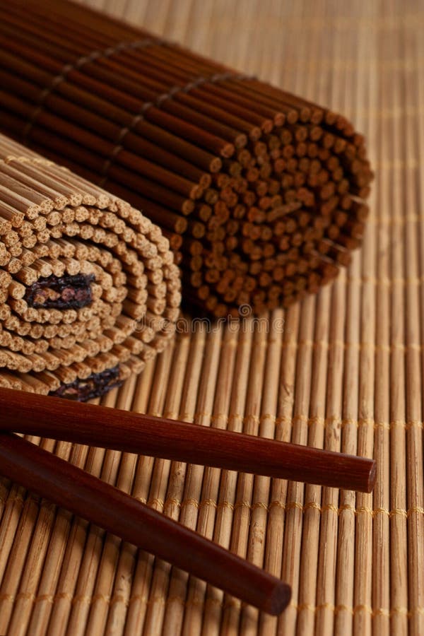 Asian Chopsticks and Bamboo mat on table