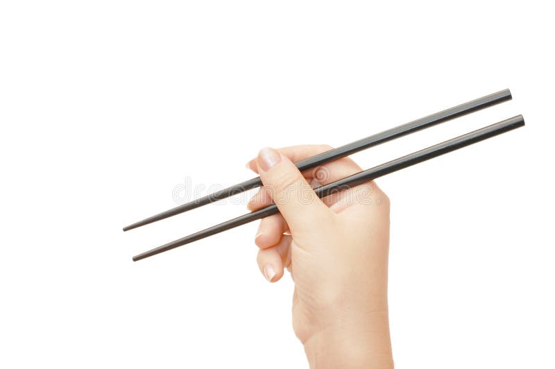 Chopsticks in a hand royalty free stock images Chopsticks in a hand royalty free stock images