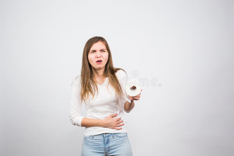 Chora kobieta z ręki odciskaniem jej crotch niski podbrzusze, mienie papieru rolka Problemy medyczni, incontinence, opieka zdrowo obraz royalty free Chora kobieta z ręki odciskaniem jej crotch niski podbrzusze, mienie papieru rolka Problemy medyczni, incontinence, opieka zdrowo obraz royalty free
