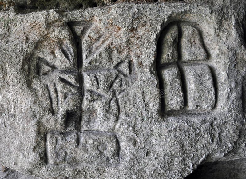 Chortkiv - Ternopil - Ukraine - September 3, 2012. Ancient German rune found on the wall of a small cave by archaeologist Volodymyr Dobryansky near the Ukrainian city of Chortkiv. Chortkiv - Ternopil - Ukraine - September 3, 2012. Ancient German rune found on the wall of a small cave by archaeologist Volodymyr Dobryansky near the Ukrainian city of Chortkiv