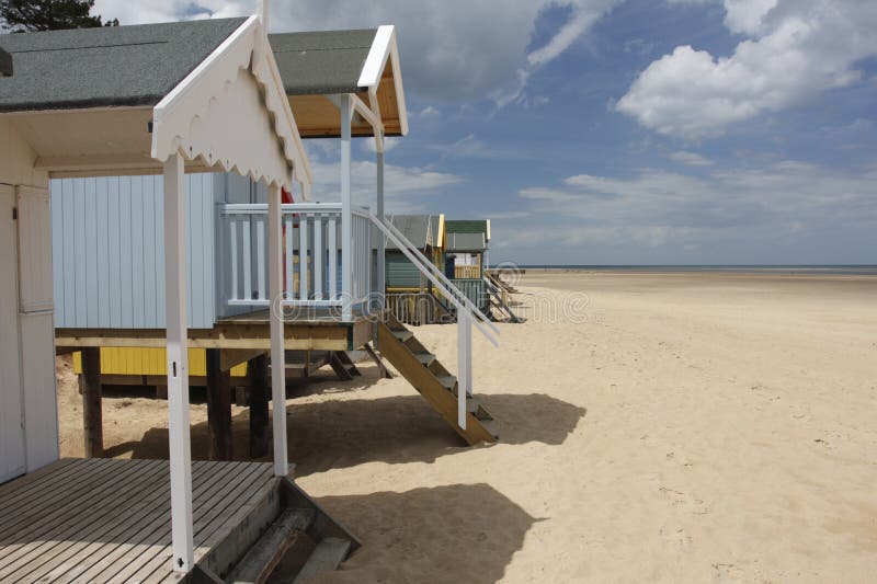 Painted beach huts on a deserted beach. Painted beach huts on a deserted beach.