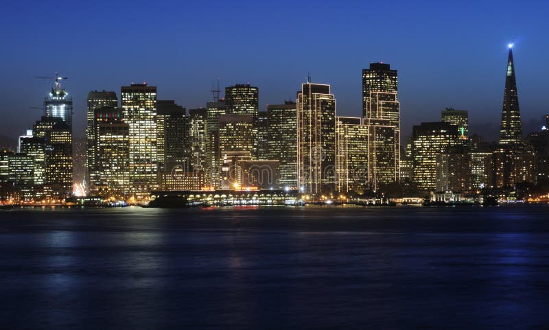 A view of San Francisco downtown decorated by Christmas lighting at dusk (shot from Treasure Island). Copyspace on top and bottom. A view of San Francisco downtown decorated by Christmas lighting at dusk (shot from Treasure Island). Copyspace on top and bottom