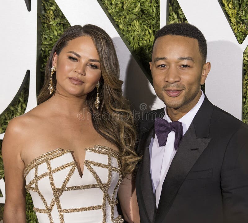 Chrissy Teigen and John Legend. Supermodel Chrissy Teigen and her singer and producer husband, John Legend, arriveson the red carpet at the 71st Annual Tony royalty free stock images Chrissy Teigen and John Legend. Supermodel Chrissy Teigen and her singer and producer husband, John Legend, arriveson the red carpet at the 71st Annual Tony royalty free stock images