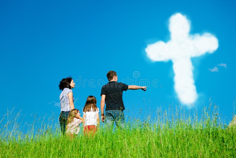 Christian Family Looking At Clouds Forming The Holy Cross