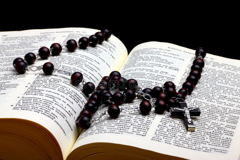 Christian Holy Bible with Cross on rosary