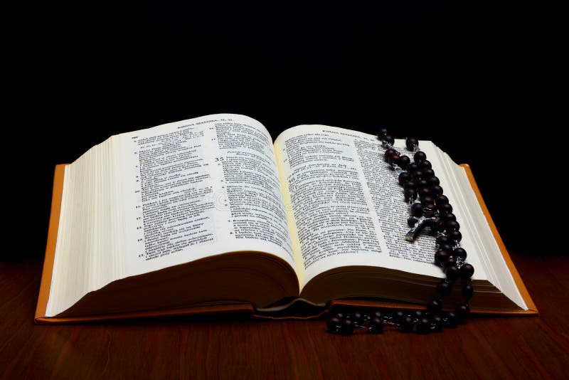 Christian Holy Bible with Cross on rosary