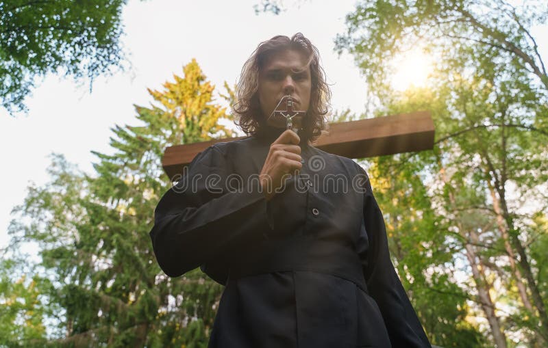 Christian priest on the cemetery. royalty free stock image