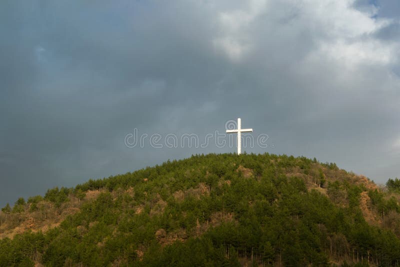 Christian symbol - The Jesus Cross - on the top of the hill