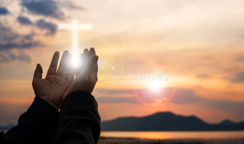 Christian woman praying worship at sunset. Hands folded in prayer. worship god with christian concept religion.