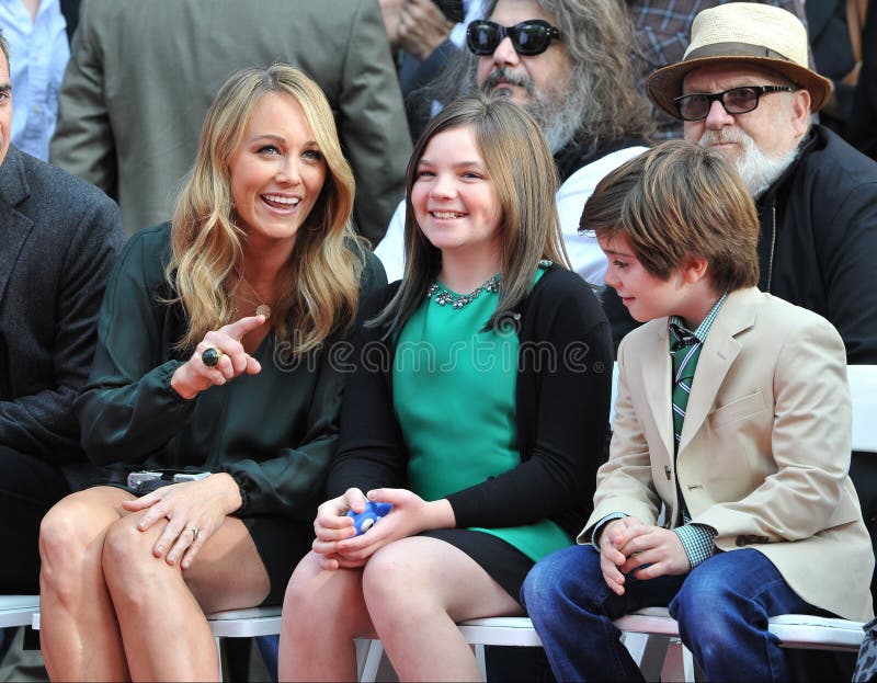 LOS ANGELES, CA - DECEMBER 3, 2013: Ben Stiller's wife Christine Taylor & children Ella, 11, & Quinlin, 8, at the TCL Chinese Theatre where Stiller had his hand & footprints set in cement. LOS ANGELES, CA - DECEMBER 3, 2013: Ben Stiller's wife Christine Taylor & children Ella, 11, & Quinlin, 8, at the TCL Chinese Theatre where Stiller had his hand & footprints set in cement.