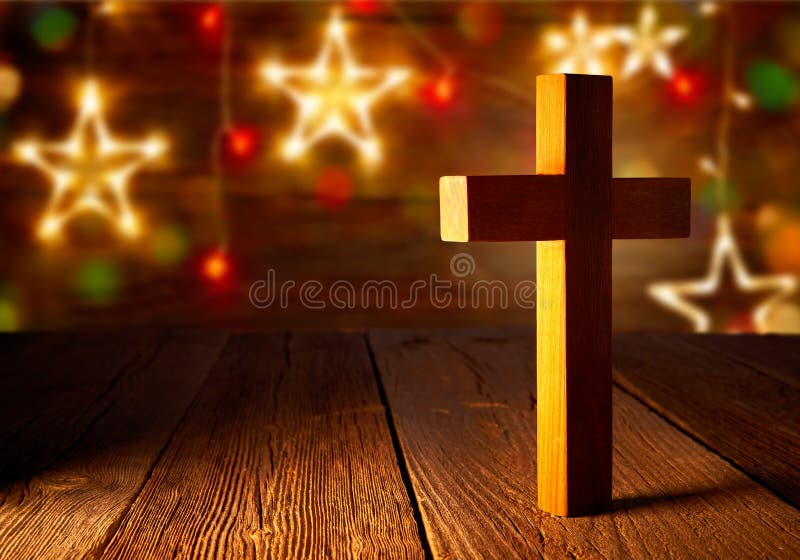 Christliches hölzernes Kreuz auf Weihnachtssternen