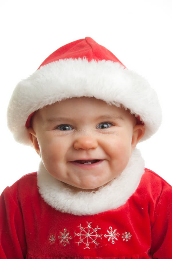 Happy baby lächelnd in rot gekleidet Weihnachten oder der Weihnachtsmann / Frau Claus outfit.