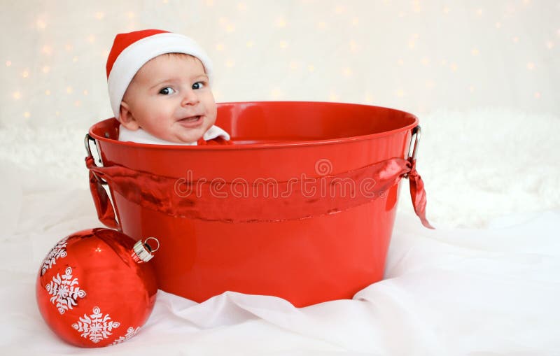 Christmas baby in red bucket