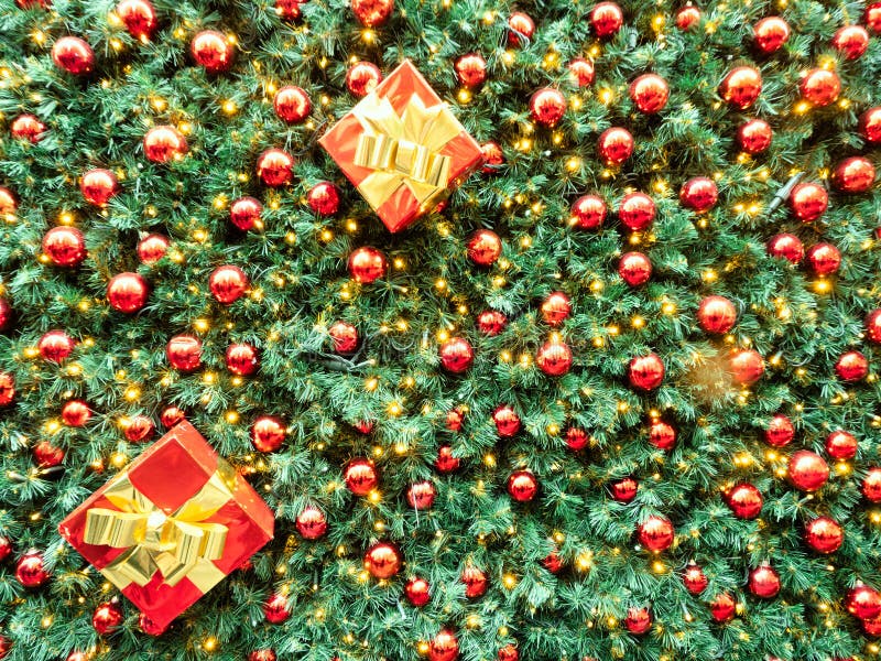 Christmas Background Decorated with Lights, Red Balls and Two Gift