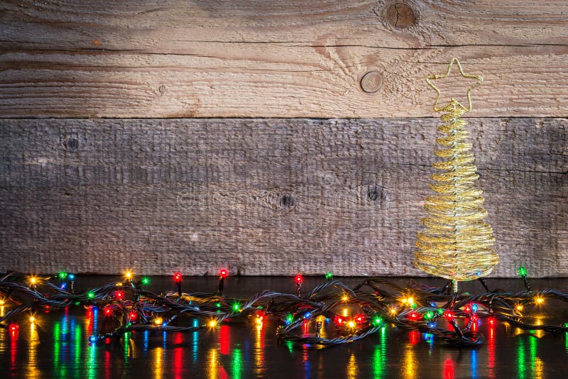 Christmas Lights on Wood Texture with Place for Text Stock Image
