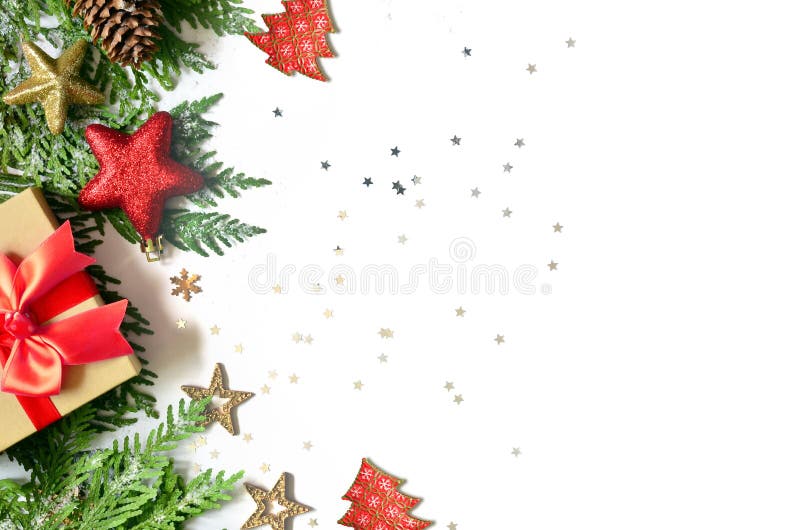 Christmas background, green pine branches, cones and gift box on white background. Creative composition with copy space