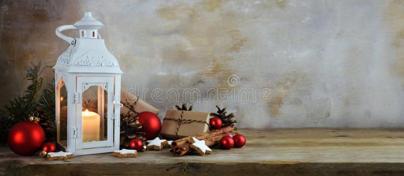 Christmas background, lantern with candle light, gifts, red ball