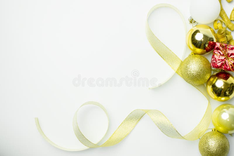 Christmas background, Merry Christmas greeting idea with decoration of red gift box and golden ribbon ball. Above white blank with copy space for happy holiday royalty free stock image Christmas background, Merry Christmas greeting idea with decoration of red gift box and golden ribbon ball. Above white blank with copy space for happy holiday royalty free stock image