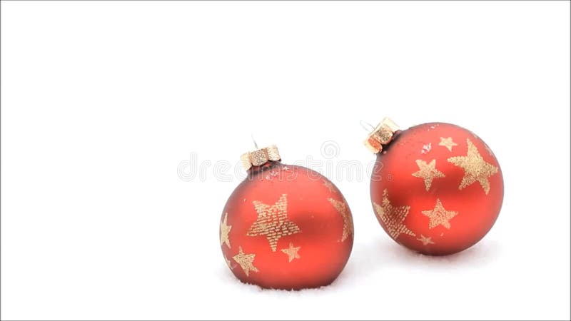 Christmas background, snowflakes falling on christmas balls