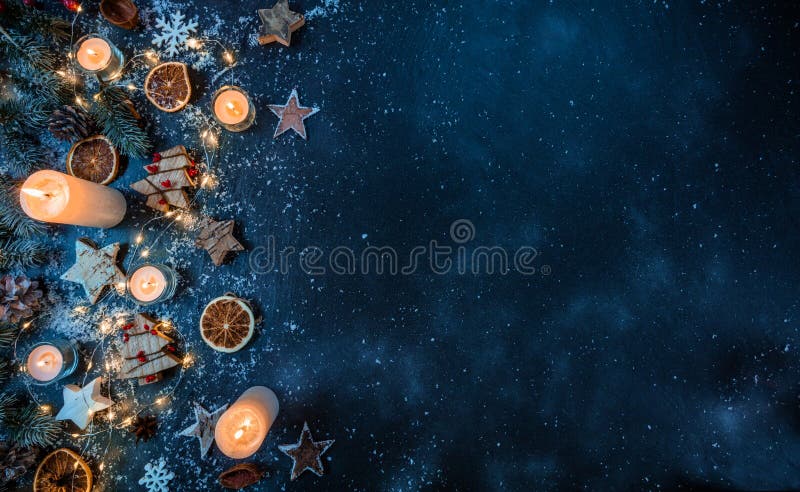 Christmas background with wooden decorations and candles. Free s