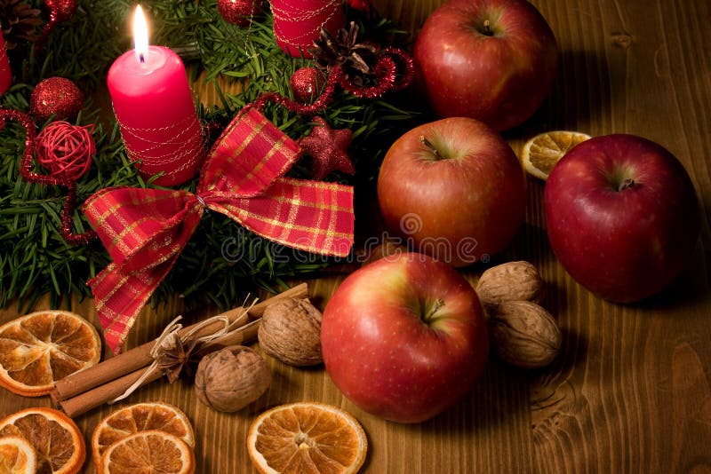 Christmas wreath with candle, apple and walnuts. Christmas wreath with candle, apple and walnuts