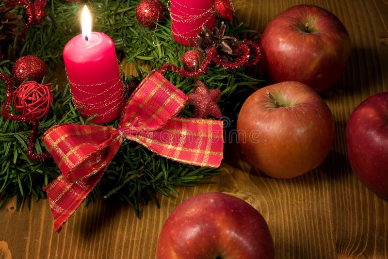 Christmas wreath with candle and apple. Christmas wreath with candle and apple