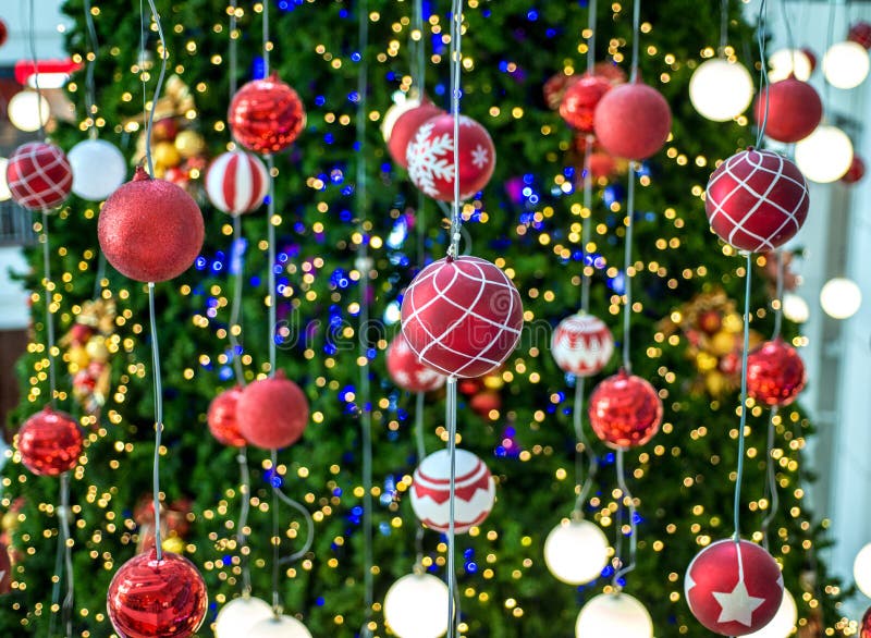Christmas Ball Hanging on a Christmas Tree with Defocused Lights. Stock ...