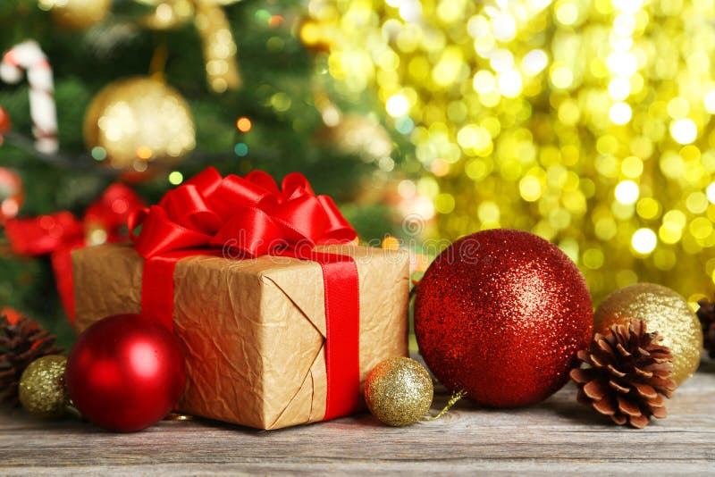 Christmas balls and Christmas gift on wooden background stock photo Christmas balls and Christmas gift on wooden background stock photo