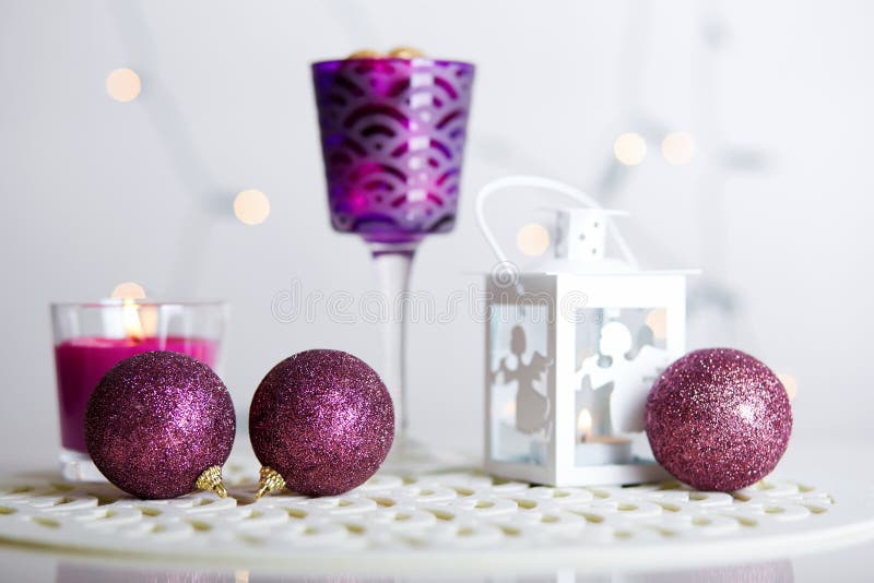 Christmas balls and shining lantern with a candle