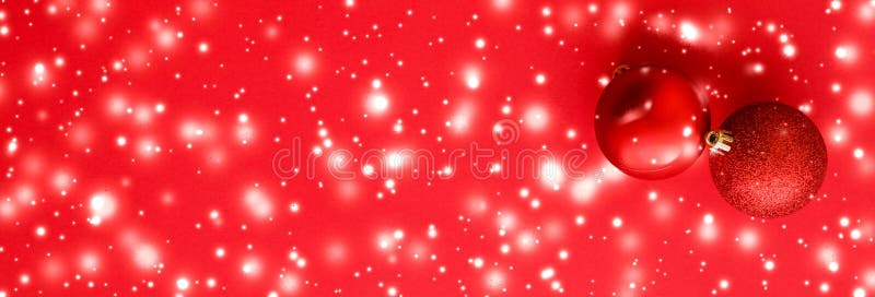 Christmas baubles on red background with snow glitter, luxury winter holiday card