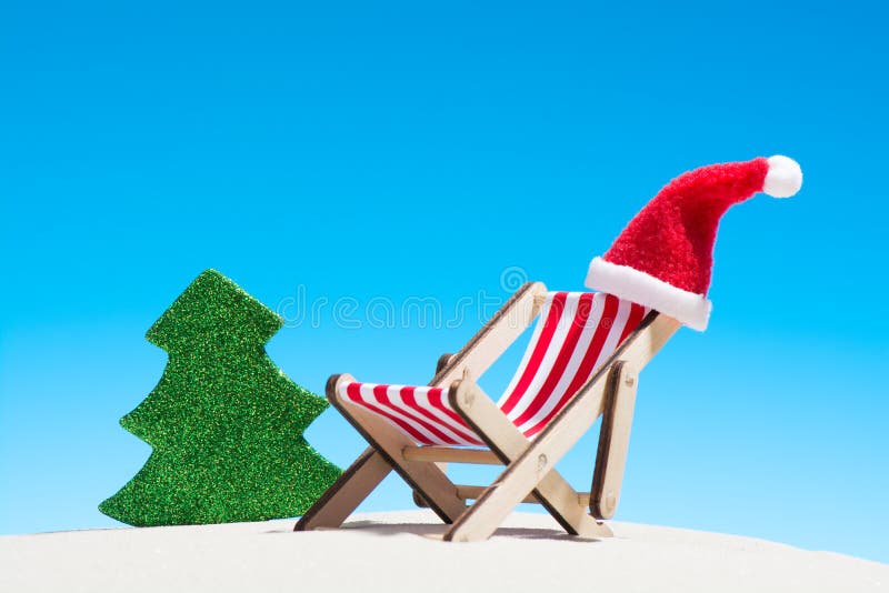 Christmas on the beach: a lounge chair with Santa hat royalty free stock images Christmas on the beach: a lounge chair with Santa hat royalty free stock images