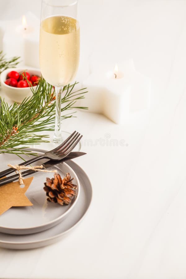 Christmas beautiful table setting with champagne and candles. Ch royalty free stock photos Christmas beautiful table setting with champagne and candles. Ch royalty free stock photos