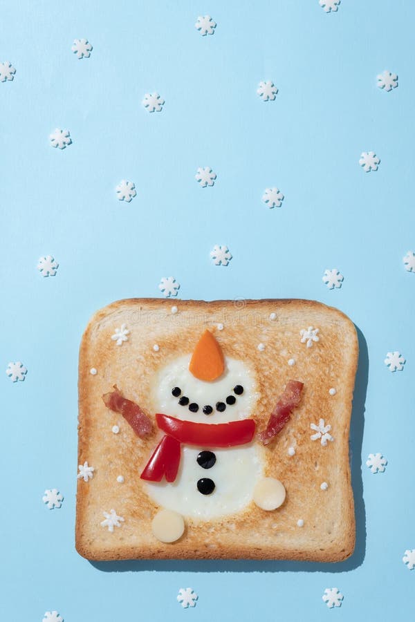 Christmas Breakfast Toast with Egg White in the Shape of Snowman Stock