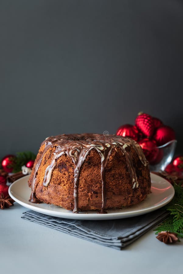 Christmas cake with chocolate icing on gray wooden background. Holiday decorations concept. Top view. Flat lay. Copy space royalty free stock photo Christmas cake with chocolate icing on gray wooden background. Holiday decorations concept. Top view. Flat lay. Copy space royalty free stock photo