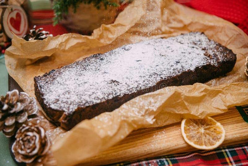 Christmas Cake with Dried Fruit Sprinkled with Powdered Sugar Stock