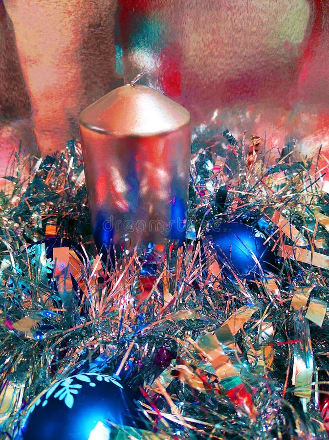 Christmas Candle and Christmas Balls in Multicolored Lights Stock