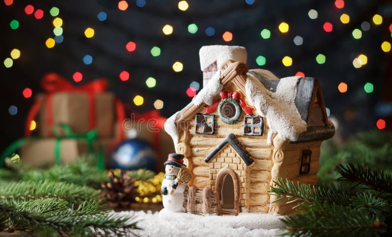 Xmas Toy Snowman Near Miniature House on Bokeh Background. Stock Photo ...