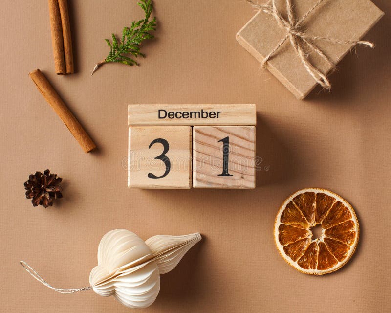 Christmas card. Christmas gift box, wooden calendar on December 31