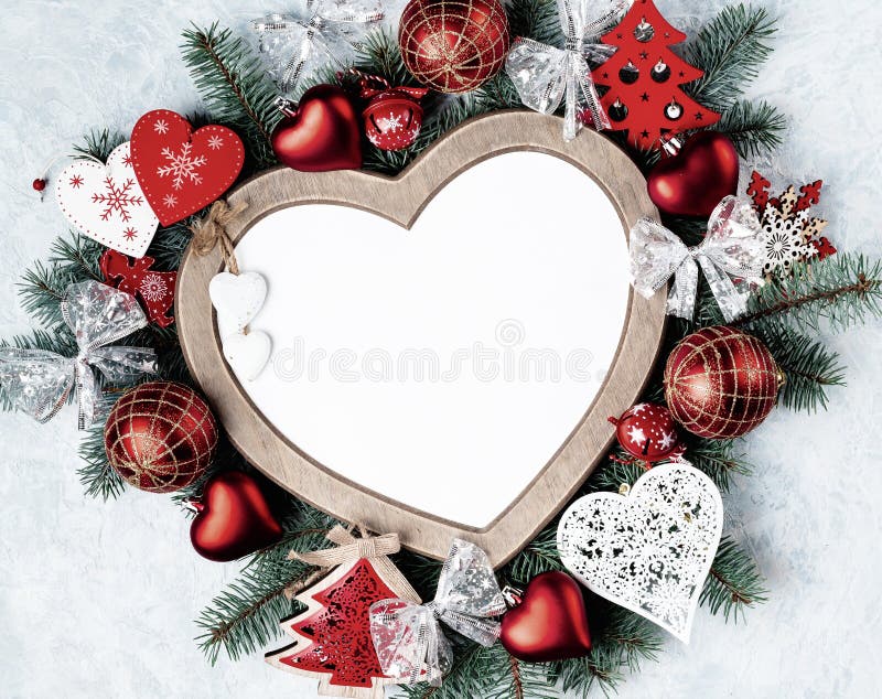 Christmas card, heart-shaped frame, with Christmas decorations, golden and red color