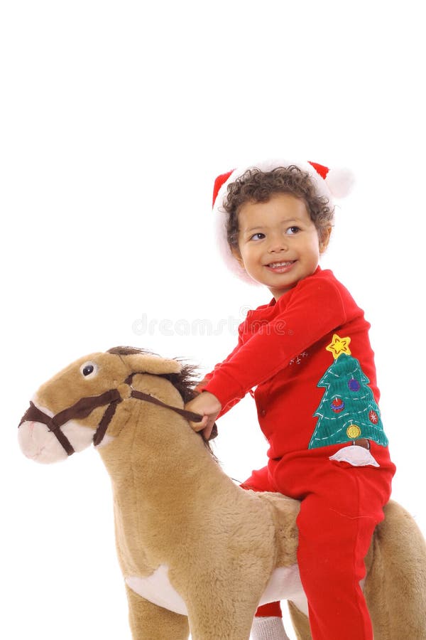 Christmas child riding a pony