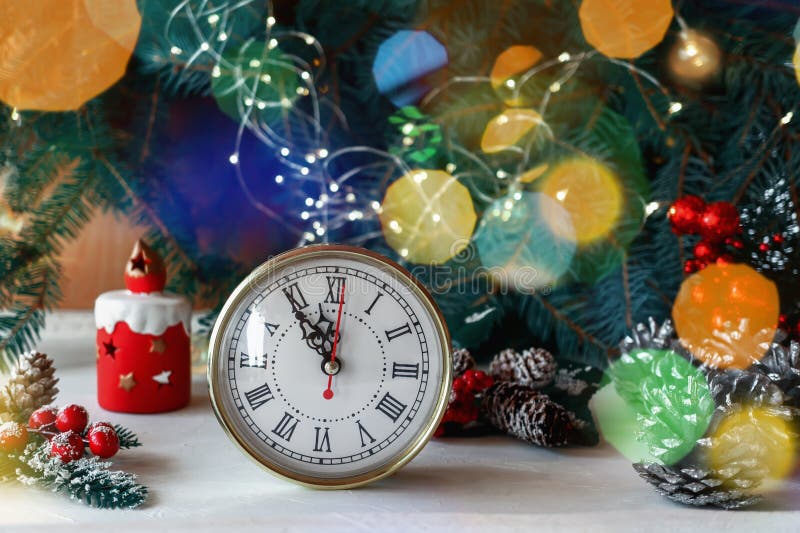Christmas Clock on a Wooden Wall with a Christmas Tree and Cones Stock