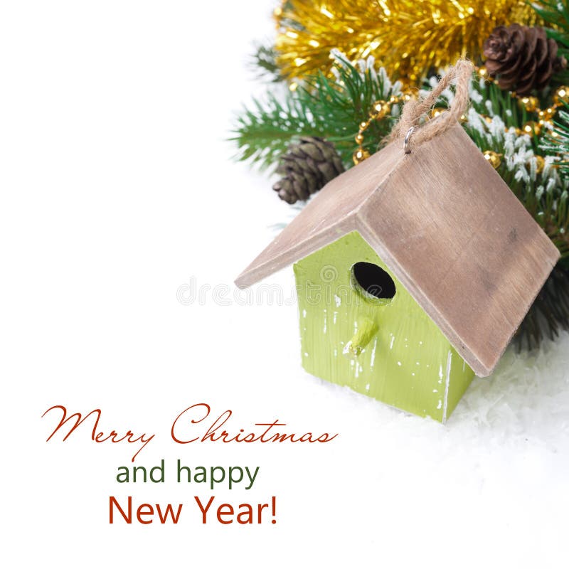 Christmas composition with fir branches, decorations, birdhouse