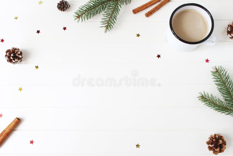 Christmas composition. Frame made of fir, spruce branches, pine cones, cinnamon sticks and glittering confetti stars on royalty free stock photography Christmas composition. Frame made of fir, spruce branches, pine cones, cinnamon sticks and glittering confetti stars on royalty free stock photography