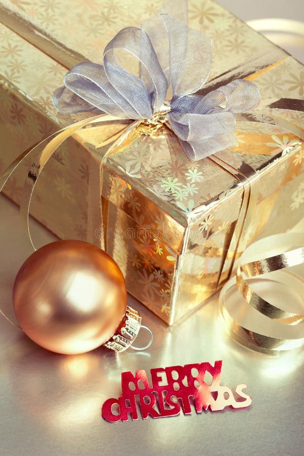 Christmas composition with gift box and bauble